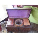 An early 19th century crossbanded mahogany rectangular tea caddy, with two boxes and cut glass