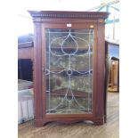 An Edwardian mahogany lead glazed corner cupboard, with velvet lined interior 70cm wide, 100cm high