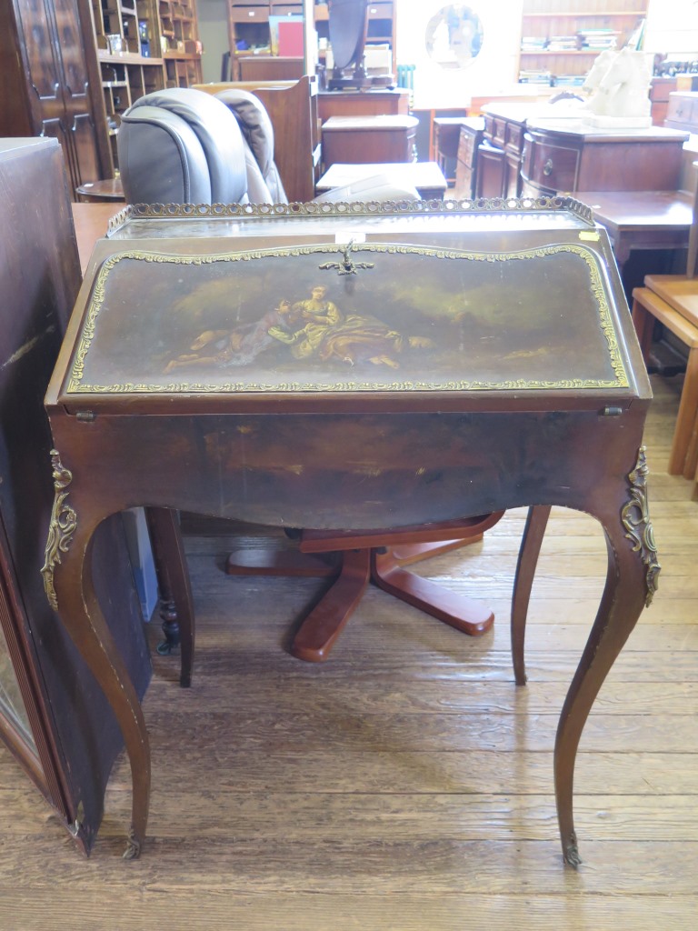 A French style painted bureau, with gilt metal mounts, depicting figures and landscapes, on cabriole