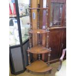 A mid Victorian inlaid walnut corner whatnot, with spiral turned supports 129cm high