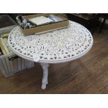A painted cast metal garden coffee table, with pierced anthemion design top on cabriole legs with