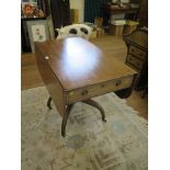 A late George III mahogany and satinwood crossbanded Pembroke table with frieze drawer over a turned