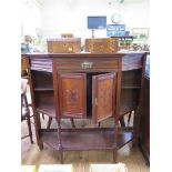 An Edwardian mahogany side cabinet, with two frieze drawers and three panelled doors, all with