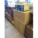 An 1950s oak dressing table and side cabinet by Meredew Furniture, the dressing table with long