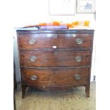 An early 19th century bowfront chest of drawers with three long drawers on outsplayed bracket