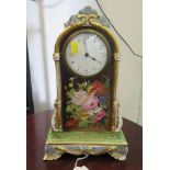 A 19th century porcelain mantel clock timepiece, the shaped case painted with floral sprays and