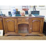 A George II style cherrywood dresser base, with central drawer and open compartment flanked by