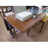 A Victorian mahogany Sutherland table, the rectangular top on baluster turned supports and bracket