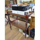 A late Victorian two tier whatnot, the rectangular galleried tiers on ring turned supports 76.5cm