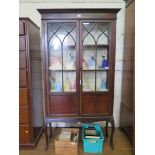 An Edwardian mahogany stain display cabinet, with astragal glazed and panelled doors on cabriole