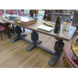 An oak refectory table, the rectangular top with copper edge over three carved cup and cover