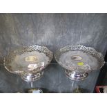 A pair of silver fruit baskets on single foot