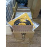 A collection of 45rpm single records, including Phil Collins, Beegees, Boney M, Erasure, Eurythmics,