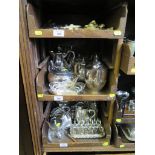 A large collection of silver plate to include tea pot, water jugs, toast rack etc, three trays