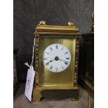 A Fema brass carriage clock with jewelled case and circular enamel dial, the movement requiring