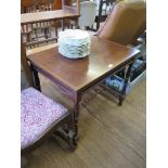 A late Victorian chevron banded mahogany table, the rectangular top on turned supports and