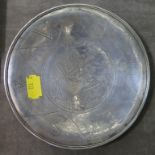 A silver dish showing Venus, some 14.5cm in diameter