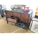 A mahogany dressing table, the central drawer flanked by two drawers on either side on square legs