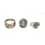 A gold and turquoise ring and two silver rings (3)