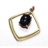 A gold mounted black opal pendant