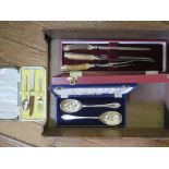 A cased carving set with horn handles silver plated by Edwin Blyde & Co Sheffield, a cased pair of