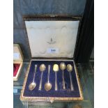 A cased set of six silver coffee spoons with folded tongue terminals, Christopher Dresser design for