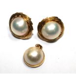 A pair of 14 carat gold and pearl earrings and matching pendant