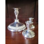 A pair of silver dwarf candlesticks, Birmingham 1980/81, and a single larger silver plated Viners of