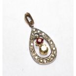 A ruby and diamond pendant