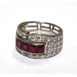 A diamond and ruby ring, in the form of a four row half eternity, the ring set with forty-four