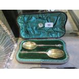 A pair of Victorian silver fruit spoons with gilt bowls and warrior finials, London 1894 in