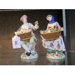 A pair of Meissen figures depicting vegetable and flower sellers, dot and cross swords mark, 21 cm