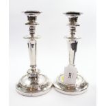 A pair of silver plated candlesticks