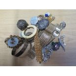 A bag of costume jewellery to include silver bangle, silver I.D. bracelet, silver brooch, silver