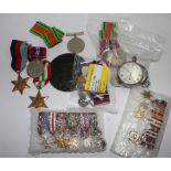 A collection of World War II medals, both regular and miniature