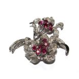 A diamond and ruby two headed flower brooch in fitted Carringtons of 130 Regent Street, London box