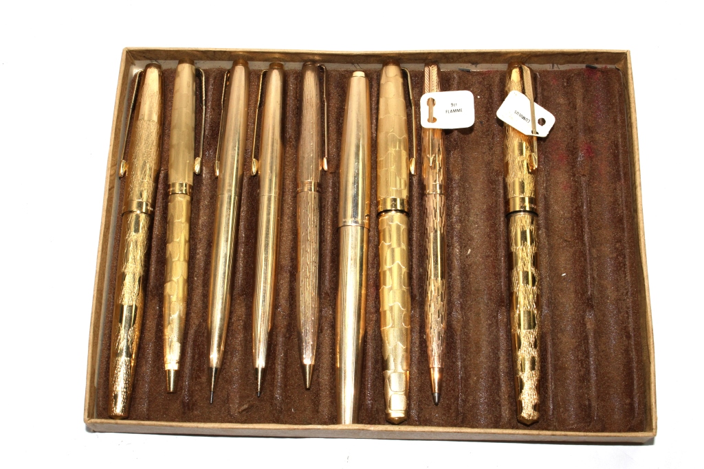 A 9 carat gold Flamme Parker ball point, three Parker rolled gold Cumulus fountain pens and ball