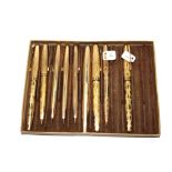 A 9 carat gold Flamme Parker ball point, three Parker rolled gold Cumulus fountain pens and ball