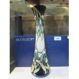 A Moorcroft Pottery 'Christmas Kiss' design waisted vase, 27/250, depicting mistletoe, signed by