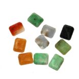 Ten small jade plaques of varying colours, each 10mm x 8mm
