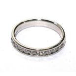 A ladies 18 carat white gold half eternity ring, set with twelve diamonds