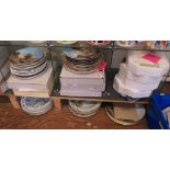 A large collection of collectors plates, some in original boxes