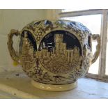 A large two handled German stoneware vintage bowl depicting various German landmarks and castles