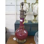 A sang de boeuf bottle vase, converted to a table lamp with brass fittings, total height 50 cm