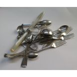 A collection of mixed silver spoons, forks, and other flatware and a silver mounted glass mustard