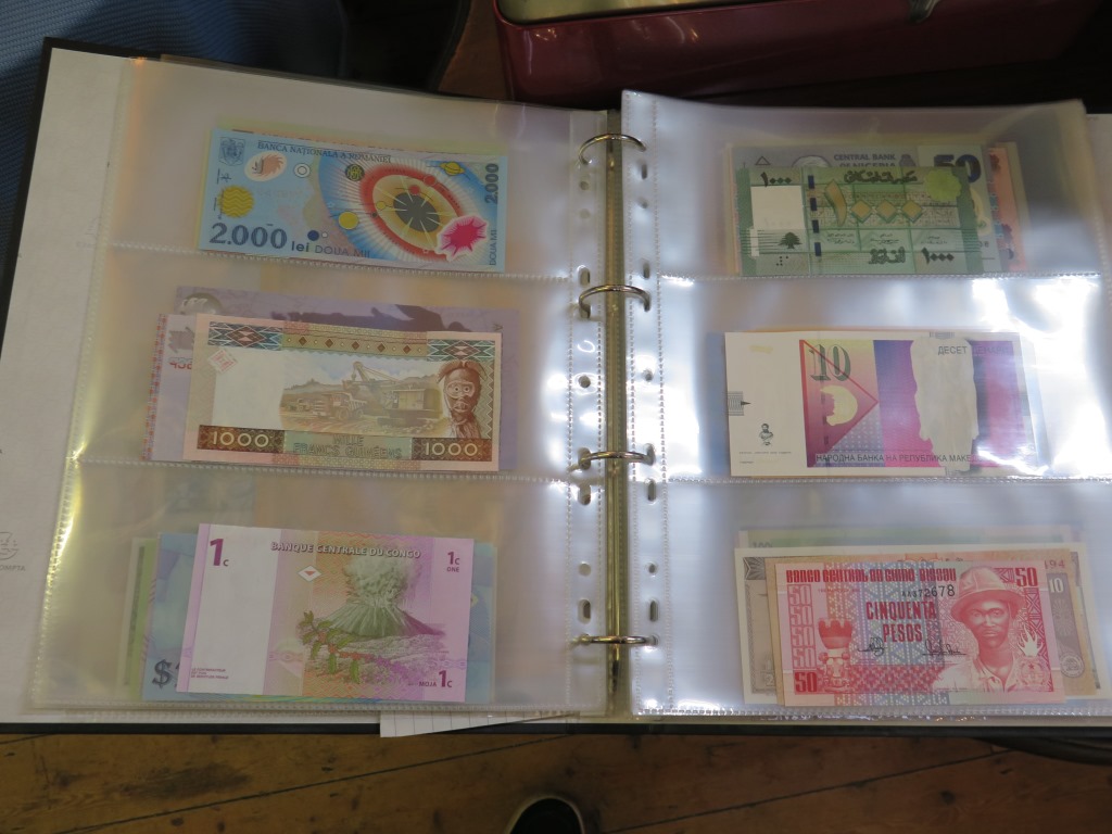 An album of international banknotes including Nigeria Zambia, Romania, Vietnam etc