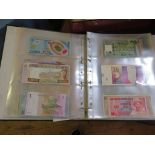An album of international banknotes including Nigeria Zambia, Romania, Vietnam etc