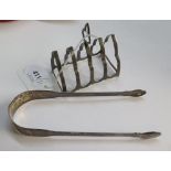 A pair of Georgian silver sugar tongs and a four division toast rack
