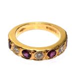 A ruby and diamond five stone ring, set in 18 carat yellow gold