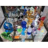 Various multi-colored glass paperweights and dishes